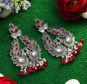 An Enhanced Look To Your Personality By Pairing Up This Beautiful Earring Set With Your Ethnic Attire. This Pretty Set Is In Silver Color Beautified With Kundan Work. Buy Now.