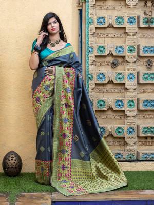 Celebrate This Festive Season In This Very Pretty Grey Colored Designer Saree Paired With Contrasting Blue Colored Blouse. This Saree and Blouse Are Banarasi Silk Based Beautified With Detailed Weaving Jacquard Saree. 