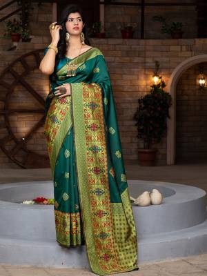 Celebrate This Festive Season In This Very Pretty Green Colored Designer Saree Paired With Contrasting Green Colored Blouse. This Saree and Blouse Are Banarasi Silk Based Beautified With Detailed Weaving Jacquard Saree. 