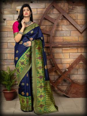 Celebrate This Festive Season In This Very Pretty Nevy Blue Colored Designer Saree Paired With Contrasting Pink Colored Blouse. This Saree and Blouse Are Banarasi Silk Based Beautified With Detailed Weaving Jacquard Saree. 