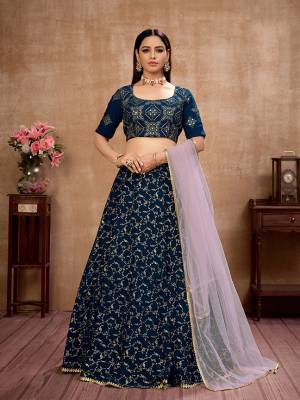 Here Is Lovely and Elegant Looking Designer Lehenga Choli In Nevy Blue Colored Blouse Paired With Nevy Blue Colored Lehenga And Pink Dupatta. Its Blouse Is Georgette Based Paired With Georgette Fabricated Lehenga And Net Fabricated Dupatta. Buy Now. 