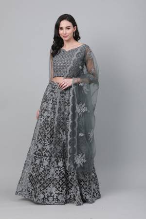 Celebrate This Festive Season With Beauty And Comfort Wearing This Lovely Heavy Designer Embroidry Lehenga Choli In Grey Colored Blouse Paired And Grey Dupatta. This Pretty Blouse And Lehenga Are Net Based Paired With Net Fabricated Dupatta