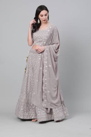 Celebrate This Festive Season With Beauty And Comfort Wearing This Lovely Heavy Designer Embroidry Lehenga Choli In Grey Colored Blouse Paired And Grey Dupatta. This Pretty Blouse And Lehenga Are Georgette Based Paired With Georgette Fabricated Dupatta