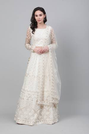 Heavy Designer Embroidery Lehenga Choli In White Color Fabricated On Net Beautified With Heavy Attractive Thread,Jari And Stone Work Embroidery. 