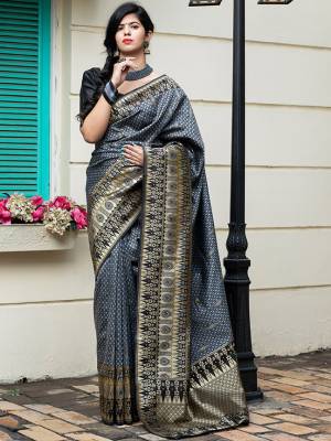 Celebrate This Festive Season In This Very Pretty Weaving Jacquard Grey Colored Designer Saree Paired With Contrasting Black Colored Blouse. This Saree and Blouse Are Banarasi Silk Based. 