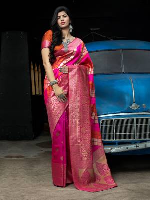 Celebrate This Festive Season In This Very Pretty Weaving Jacquard Pink Colored Designer Saree Paired With Contrasting Orange Colored Blouse. This Saree and Blouse Are Banarasi Silk Based. 