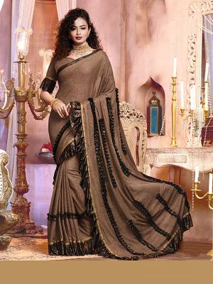 Adorn The Pretty Angelic Look Wearing This Heavy Hand Designer Saree In Dusty Color Paired With Contrasting Colored Blouse. This Saree Is Fabricated On Importerd Lycara Paired With Blouse. Its Pretty Color Pallete Will Give An Attractive Look To Your Personality. 