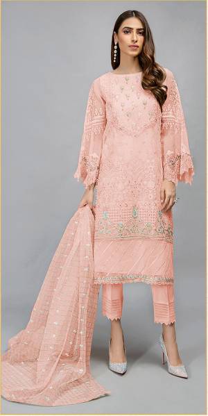 Look This Pretty Heavy Embroidered Pakistani Designer Salwar Kameez In Peach Color. Its Embroidered Top Is Organza Based Paired With Santoon Bottom and Organza Fabricated Embroidered Dupatta.