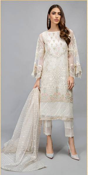 Look This Pretty Heavy Embroidered Pakistani Designer Salwar Kameez In Off White Color. Its Embroidered Top Is Organza Based Paired With Santoon Bottom and Organza Fabricated Embroidered Dupatta.