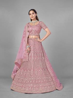 Look Pretty In This Beautiful Heavy Designer Lehenga Choli Is Light Color. This Attractive Embroidered Lehenga Choli Is Fabricated On Soft Net Paired With Soft Net Fabricated Dupatta. It Is Light In Weight And Easy To Carry All Day Long.