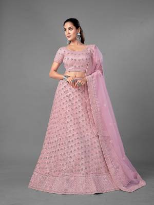 Look Pretty In This Beautiful Heavy Designer Lehenga Choli Is Light Color. This Attractive Embroidered Lehenga Choli Is Fabricated On Soft Net Paired With Soft Net Fabricated Dupatta. It Is Light In Weight And Easy To Carry All Day Long.