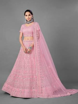 Look Pretty In This Beautiful Heavy Designer Lehenga Choli Is Light Color. This Attractive Embroidered Lehenga Choli Is Fabricated On Soft Net Paired With Soft Net Fabricated Dupatta. It Is Light In Weight And Easy To Carry All Day Long.