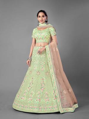 Look Pretty In This Beautiful Heavy Designer Lehenga Choli Is Light Color. This Attractive Embroidered Lehenga Choli Is Fabricated On Soft Net Paired With Soft Net Fabricated Dupatta. It Is Light In Weight And Easy To Carry All Day Long.