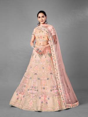 Look Pretty In This Beautiful Heavy Designer Lehenga Choli Is Light Color. This Attractive Embroidered Lehenga Choli Is Fabricated On Soft Net Paired With Soft Net Fabricated Dupatta. It Is Light In Weight And Easy To Carry All Day Long.