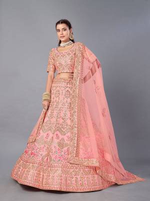 This Beautiful Heavy Designer Lehenga Choli Is Peach Color. This Attractive Embroidered Lehenga Choli Is Fabricated On Art Silk Paired With Soft Net Fabricated Dupatta. It Is Light In Weight And Easy To Carry All Day Long.