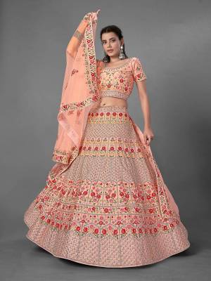 This Beautiful Heavy Designer Lehenga Choli Is Peach Color. This Attractive Embroidered Lehenga Choli Is Fabricated On Art Silk Paired With Soft Net Fabricated Dupatta. It Is Light In Weight And Easy To Carry All Day Long.