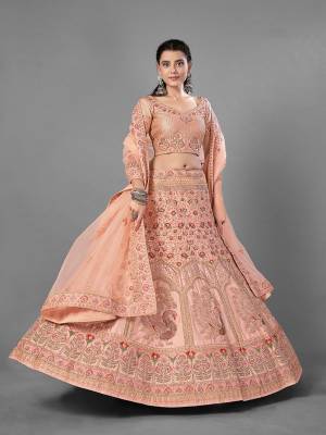 This Beautiful Heavy Designer Lehenga Choli Is Peach Color. This Attractive Embroidered Lehenga Choli Is Fabricated On Satin Paired With Soft Net Fabricated Dupatta. It Is Light In Weight And Easy To Carry All Day Long.