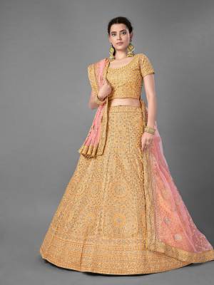 This Beautiful Heavy Designer Lehenga Choli Is Yellow Color. This Attractive Embroidered Lehenga Choli Is Fabricated On Art Silk Paired With Soft Net Fabricated Dupatta. It Is Light In Weight And Easy To Carry All Day Long.