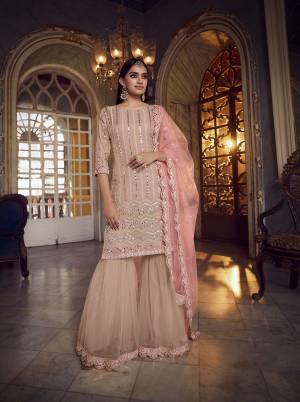 Get Ready For The Upcoming Festive And Wedding Season Wearing This Heavy Designer Embroidery With Foil Mirror Work Sharara Suit In Light Color. Its Top Are Fabricated Organza And Bottom And Dupatta Are Fabricated on Soft Net. Buy Now.