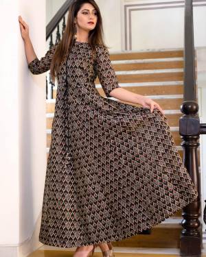 Flaunt Your Rich And Elegant Taste Wearing This Designer Readymade Long Gown In Grey Brown Color. This  Pretty Gown Is Fabricated On Maslin Beautified With Digital Printed. Its Fabric Is Soft Towards Skin And Easy To Carry All Day Long. 