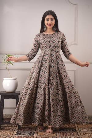 Your Rich And Elegant Taste Wearing This Hand Screen And Foil Printed Designer Readymade Long Gown In Beige Color. This  Pretty Gown Is Fabricated On Chanderi with Cotton Crepe Inner Beautified. Its Fabric Is Soft Towards Skin And Easy To Carry All Day Long. 