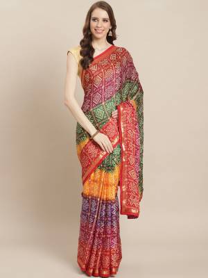 Garb This Very Pretty Colored Bandhej Printed Saree Paired With Blouse. This Saree Are Moss Georgette With Blouse With Detailed Bandhani Printed With Lase Border. 