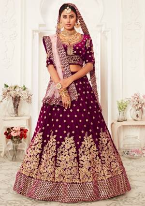 Garb This Heavy Designer Lehenga Choli In All Over Color. This Heavy Embroidered Lehenga Choli Is Velvet Based Paired With Soft Net Fabricated Dupatta, It Is Beautified With Lovely Detailed Heavy Embroidery Giving An Attractive Look.