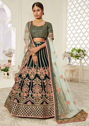 Garb This Heavy Designer Lehenga Choli In All Over Color. This Heavy Embroidered Lehenga Choli Is Velvet Based Paired With Soft Net Fabricated Dupatta, It Is Beautified With Lovely Detailed Heavy Embroidery Giving An Attractive Look.