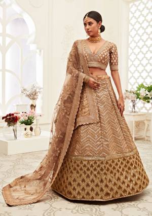 Garb This Heavy Designer Lehenga Choli In All Over Color. This Heavy Embroidered Lehenga Choli Is Slub Silk Based Paired With Soft Net Fabricated Dupatta, It Is Beautified With Lovely Detailed Heavy Embroidery Giving An Attractive Look.