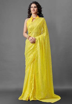 Attrective Look This Pretty Elegant Looking Designer Party Wear Saree In Yellow Color Paired With Blouse. This Saree Are Georgette And Blouse Are Banglori Silk Based With Designer Sequance Embroidery Work Beautified Saree. Buy Now.