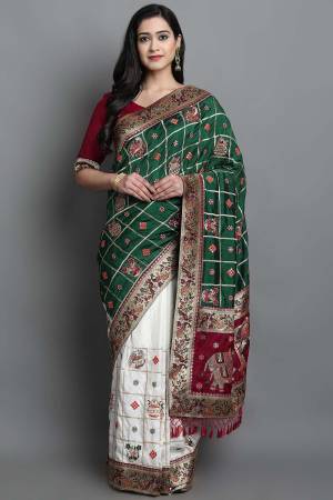 Adorn The Pretty Angelic Look Wearing This Heavy Designer Patola Embroidery,Diamond Work Saree With Contrasting Blouse. This Saree Is Fabricated On Soft Silk Paired With Satin Silk Fabricated Blouse. Its Pretty Color Pallete Will Give An Attractive Look To Your Personality. 