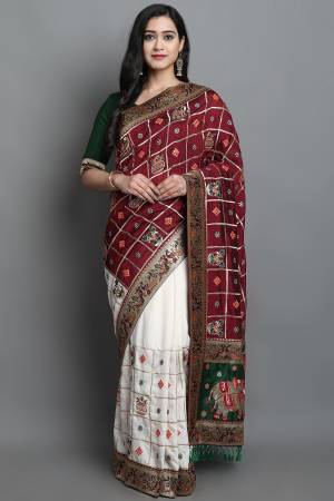 Adorn The Pretty Angelic Look Wearing This Heavy Designer Patola Embroidery,Diamond Work Saree With Contrasting Blouse. This Saree Is Fabricated On Soft Silk Paired With Satin Silk Fabricated Blouse. Its Pretty Color Pallete Will Give An Attractive Look To Your Personality. 