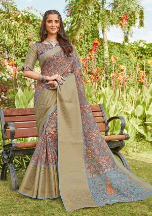 Celebrate This Festive Season In This Very Pretty Fancy Colored Designer Saree Paired With Blouse. This Saree and Blouse Are Linen Based Beautified With Detailed Wevon Pallu Border And Digital Printed Saree. 