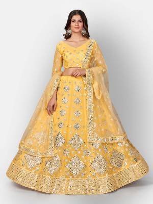 Attrective Look  Heavy Designer Bridal Lehenga Choli In Fine Color. This Heavy Embroidered Lehenga Choli Is  Organza Based Paired With Soft Net Fabricated Dupatta, It Is Beautified With Lovely Detailed Multy Thread Foil Miror Embroidery Work Giving An Attractive Look.