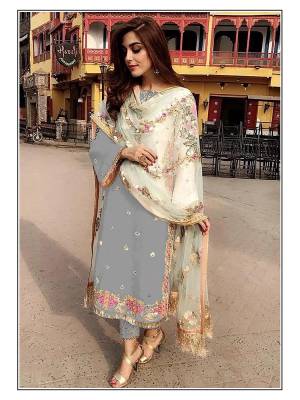 Attrective Look This Designer Suit In Fine Color Paired With Dupatta. Its Heacy Embroidery And Moti Work Top Is Fabricated On Faux Georgette Paired With Santoon Bottom And Soft Net Fabricated Dupatta. Buy this Suit Now.