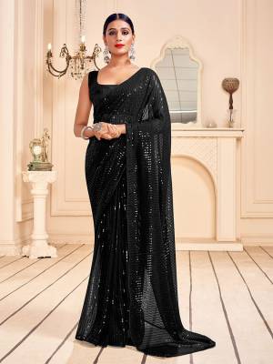 Garb This Party Wear Saree Are Fine Saree Paired With Matching Blouse.This Heavy Designer Sequance Embroidery Work Saree Is Faux Georgette Based And Blouse Are Art Silk Fabric. Which Gives A Rich Look To Your Personality. Buy This Pretty Saree Now.