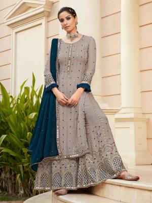 Look Pretty This Designer Long Length Suit In Lovely Fine Light Color.?Its Pretty Heavy Designer Embroidred,Real Mirror,Diamond Work Top Is Faux Georgette Based Paired With Dull Santoon Bottom And Faux Georgette Fabricated Work Dupatta Which Gives An Attractive To The Suit.