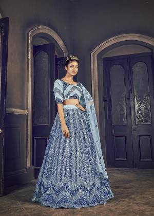 Attrective Bridal Partywear Heavy Designer Lehenga Choli And Dupatta In Grey Color Fabricated On Net Beautified With Heavy Attractive Seaqoance Embroidery Work. 