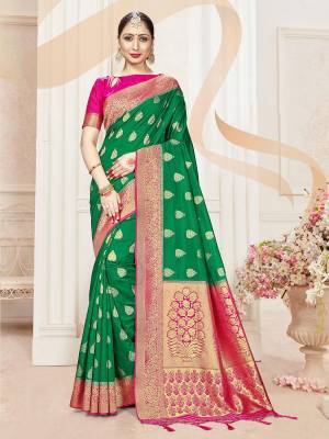 Attractive Wearing This Fine Colored Saree Paired With Contreased Blouse.This Heavy Designer Wevon Saree Is Banarasi Silk Based Which Gives A Rich Look To Your Personality. Buy This Pretty Saree Now.