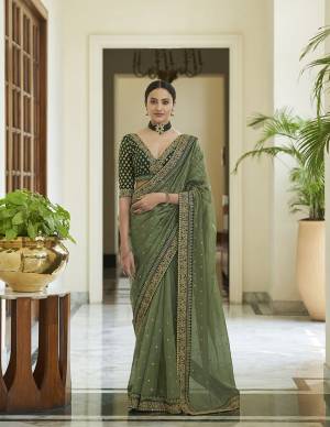 Look Attrectiv This Partywear Saree Are Fine Saree Paired With Blouse.This Saree Are Art Silk And Blouse Are Organza Fabric With Heavy Designer Work Based. Buy This Pretty Saree Now.