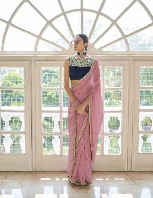 Look Attrectiv This Partywear Saree Are Fine Saree Paired With Blouse.This Saree Are Art Silk And Blouse Are Georgette Fabric With Heavy Designer Work Based. Buy This Pretty Saree Now.