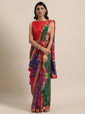 Garb This Saree Are Fine Saree Paired With Blouse.This Saree Are Georgette And Blouse Are Art Silk Fabric With Designer Bandhani Printed. Buy This Pretty Saree Now.