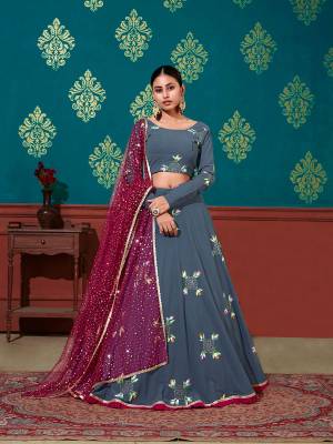 Look Attrective Partywear Heavy Designer Lehenga Choli And Dupatta In Fine Color. Lahenga Choli Are Fabricated On Georgette Beautified And Dupatta Are Net With Attrective Pigment Foil Printed And Mirror Work. 