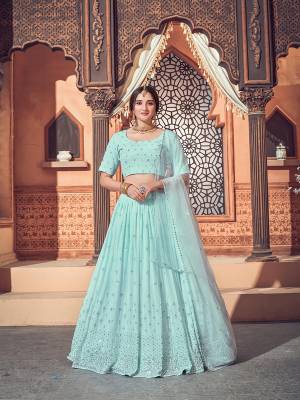 Garb This Wedding Partywear Heavy Designer Lehenga Choli And Dupatta In Fine Color Fabricated On Georgette Beautified With Heavy Attractive Thread,Sequance Embroidery Work. 