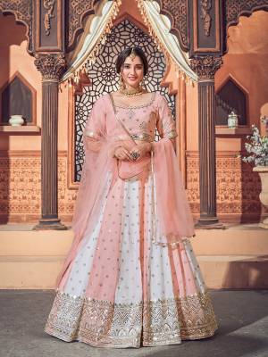 Garb This Wedding Partywear Heavy Designer Lehenga Choli And Dupatta In Fine Color Fabricated On Georgette Beautified With Heavy Attractive Thread,Sequance Embroidery Work. 