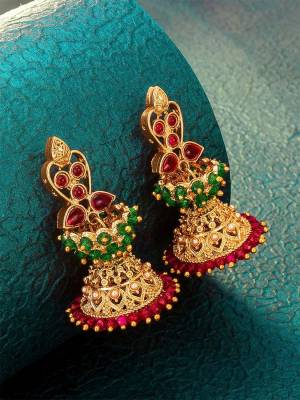 Give An Enhanced Look To Your Personality By Pairing Up This Beautiful Earring With Your Ethnic Attire. This Pretty Set Is In Gold Color Beautified With Kundan Work. Buy Now.