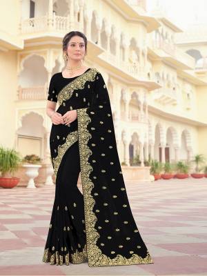 Attrective Look This Traditionl Partywear Saree Are Fine Saree Paired With Blouse.This Saree And Blouse Are Two Tone Vichitra Silk Based Fabric With Heavy Designer Jari Embroidery,Stone Work. Buy This Pretty Saree Now.