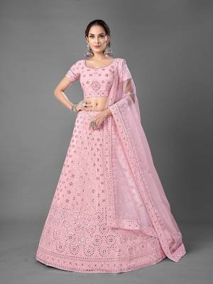 Look Attrective This Wedding Partywear Heavy Designer Lehenga Choli And Dupatta In Fine Color Fabricated On Georgette Beautified With Heavy Attractive Embroidery Work. 