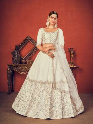 Garb This Wedding Partywear Heavy Designer Lehenga Choli And Dupatta In Fine Color Fabricated On Art Silk Beautified With Heavy Attractive Thread,Sequance Embroidery Work. 