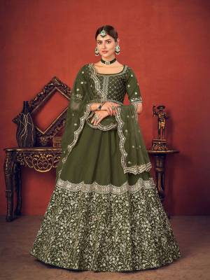 Garb This Wedding Partywear Heavy Designer Lehenga Choli And Dupatta In Fine Color Fabricated On Art Silk Beautified With Heavy Attractive Thread,Sequance Embroidery Work. 